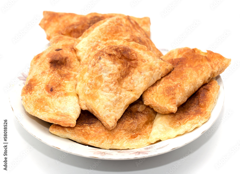 fresh tasty meat pies on a white background