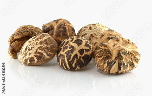 dried shiitake mushrooms on white background
