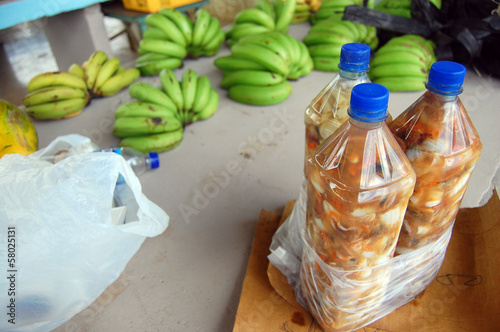 Bottles and bananas at town market