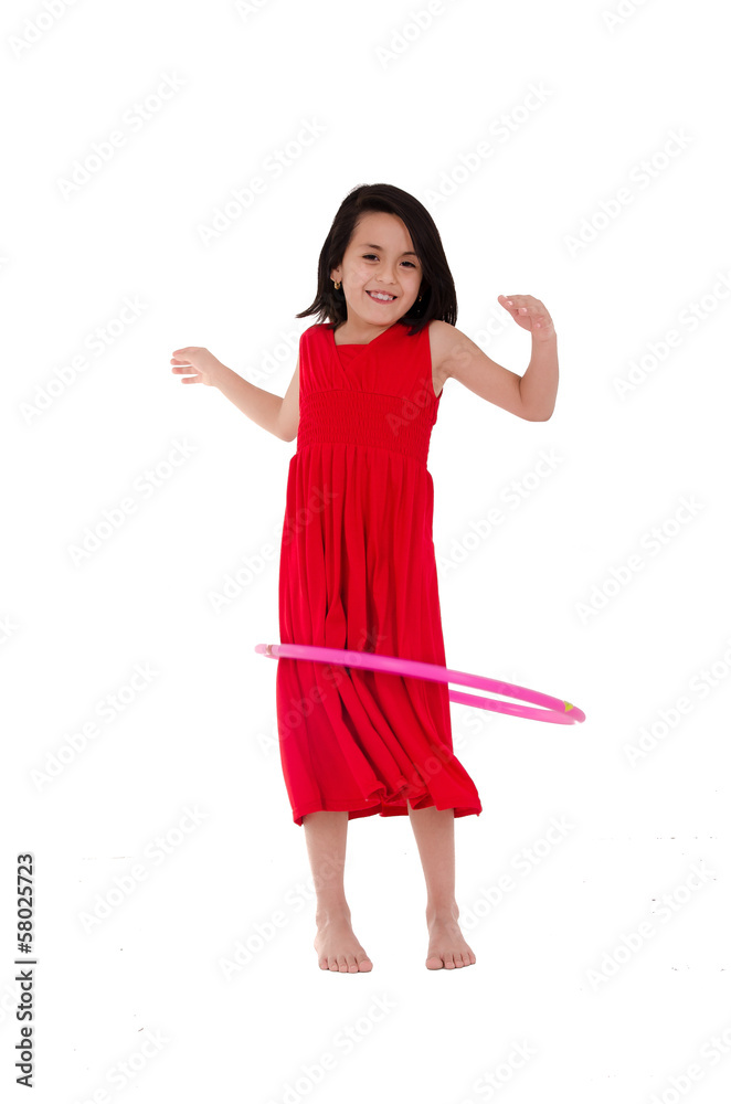 Young girl playing with hula hoop isolated over white background