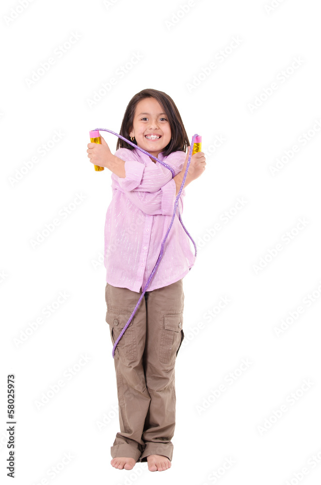 Seven years Girl with skipping rope isolated on white