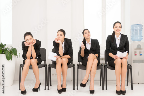 Four different poses of one woman waiting for interview. =