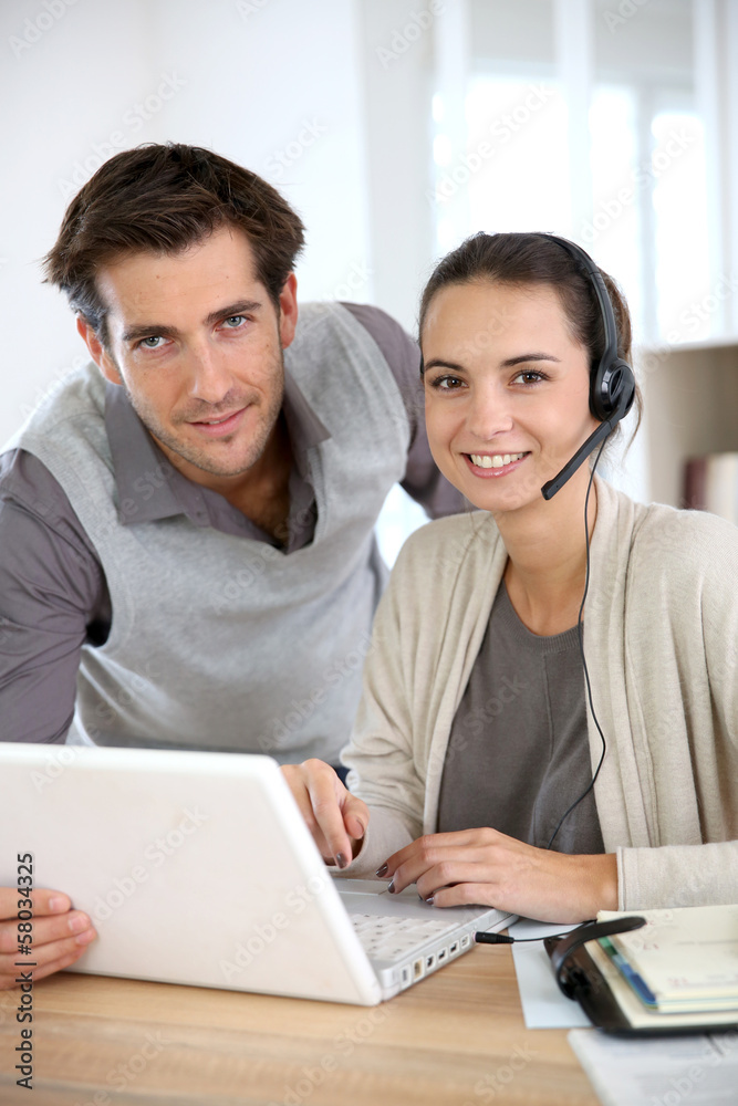 Business people working in customer service department Business people working in customer service department