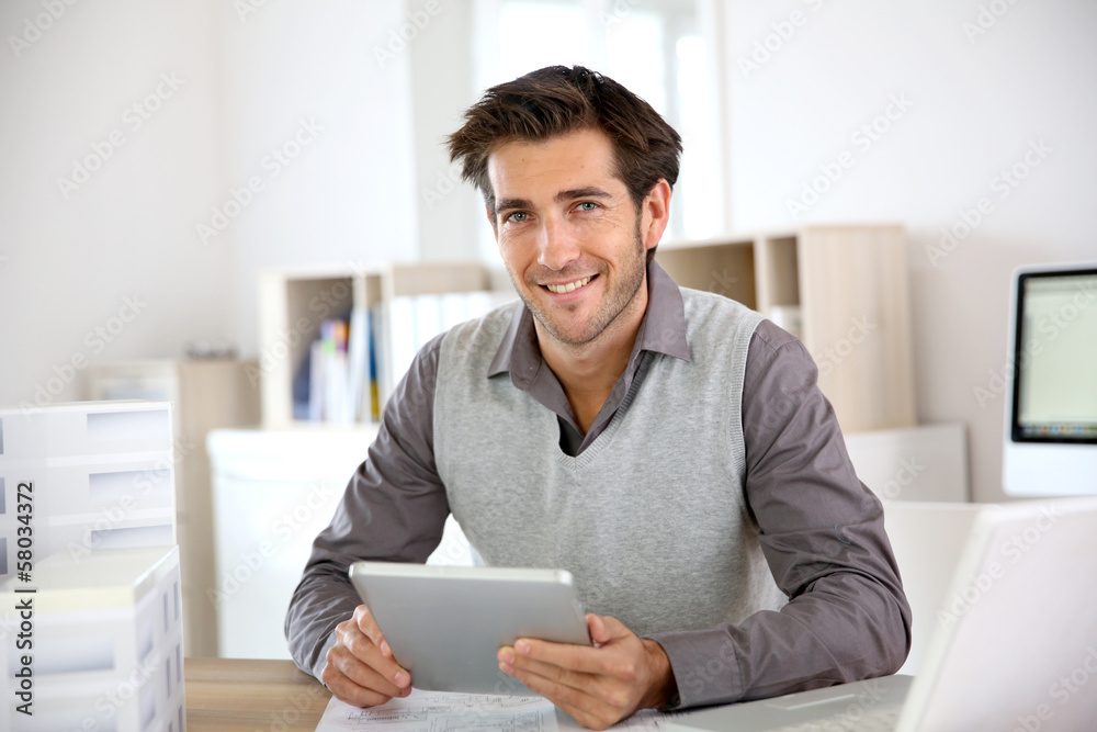 Portrait of architect using tablet in office Portrait of architect using tablet in office