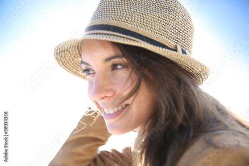 Portrait of attractive woman wearing hat