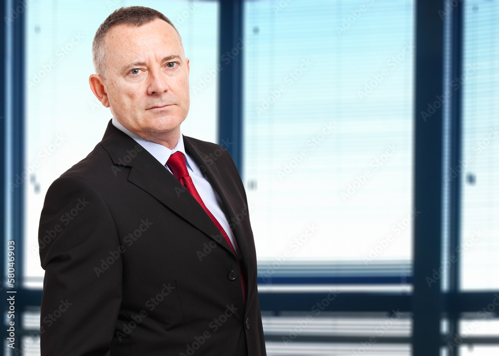 Confident businessman in the office Confident businessman in the office