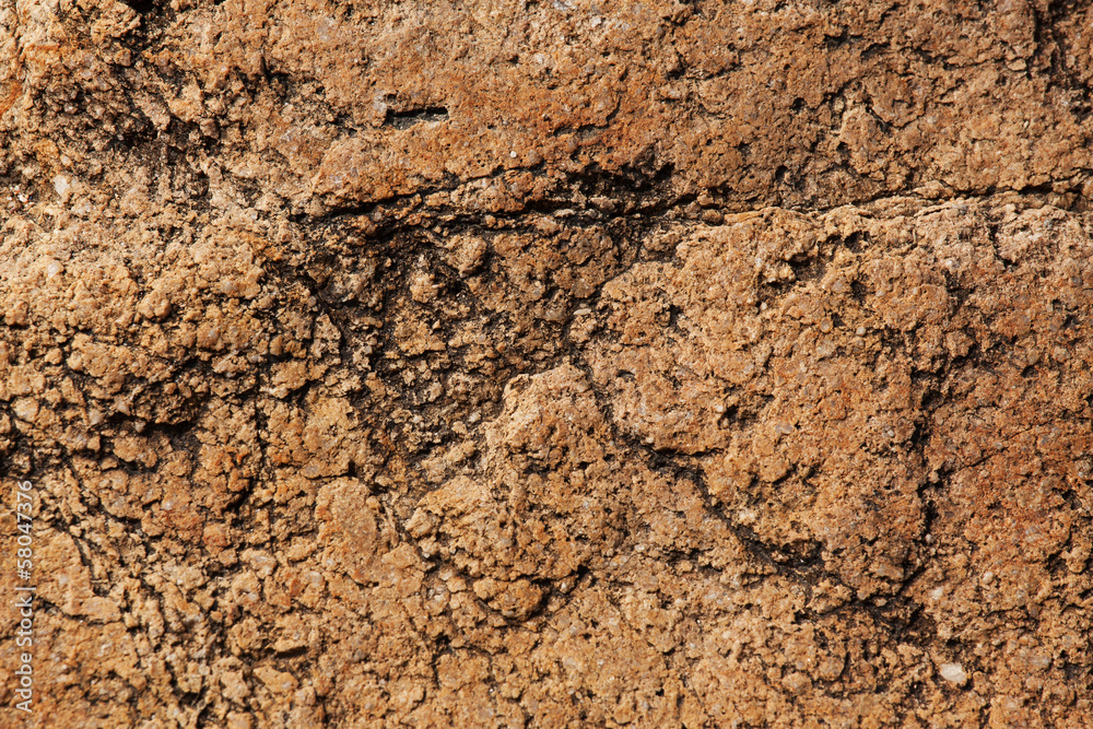 Stones of red color with cracks on the surface