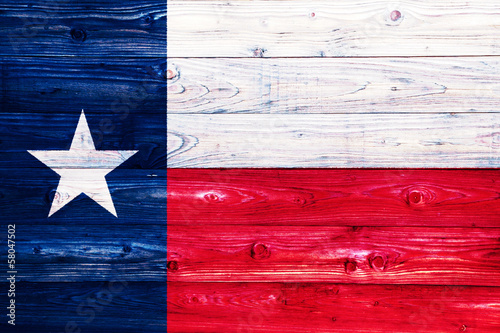 Flag of Texas on wooden surface