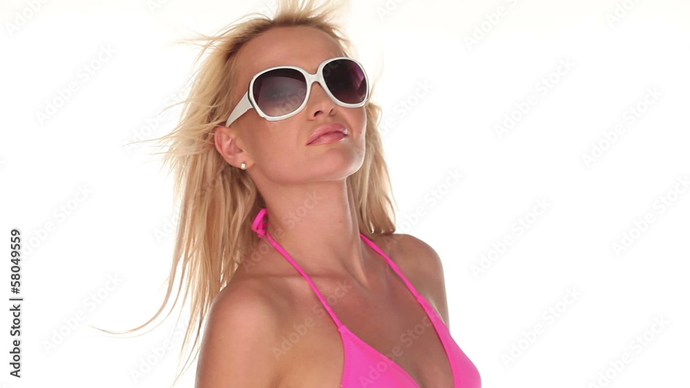 Sexy woman in sunglasses with blowing hair