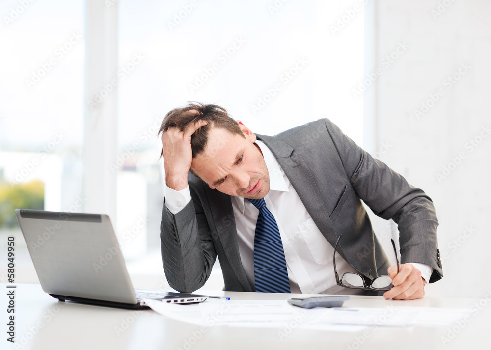 businessman with computer, papers and calculator businessman with computer, papers and calculator