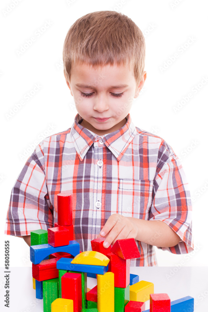 cute preschool boy play colorful wood block cute preschool boy play colorful wood block