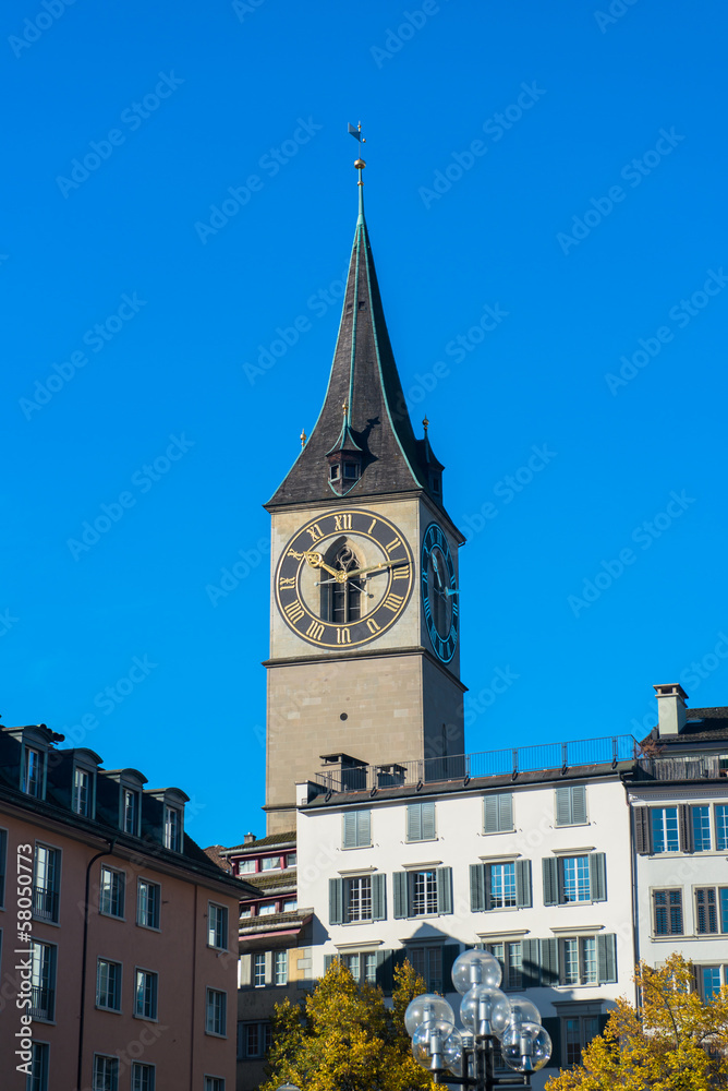 Clock tower over the buildings in Zurich, Switzerland Clock tower over the buildings in Zurich, Switzerland