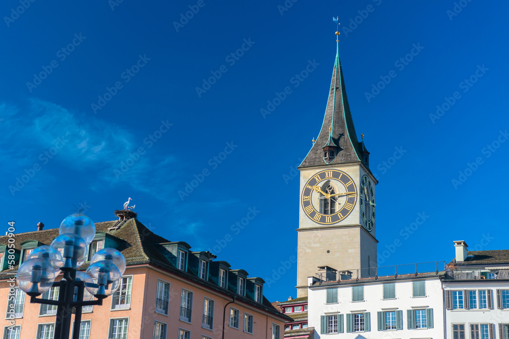 Clock tower over the buildings in Zurich, Switzerland