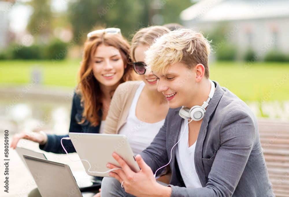 students or teenagers with laptop computers students or teenagers with laptop computers