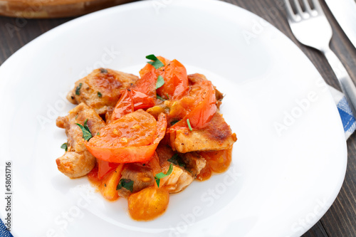 Fried pork with pan-roasted tomatoes