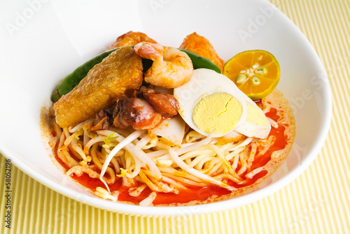 Photography Curry Laksa which is a popular traditional spicy noodle soup fro
