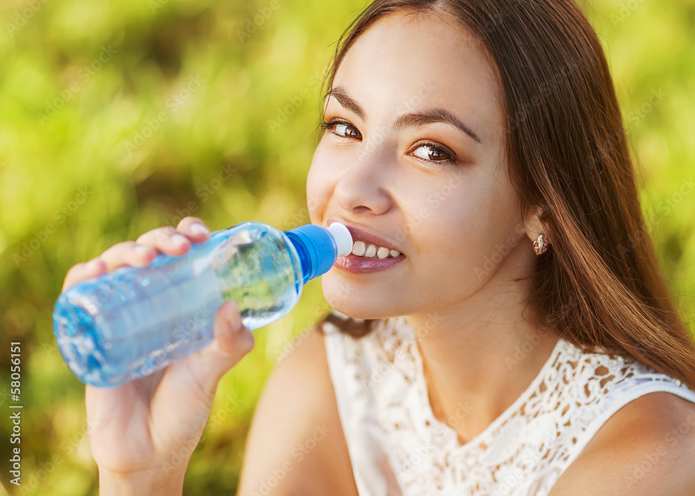 Portrait of young beautiful dark-haired woman drink water Portrait of young beautiful dark-haired woman drink water