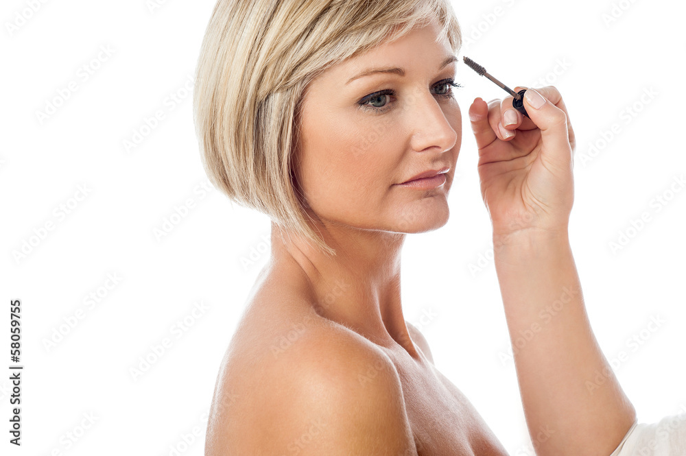 Beautiful female model getting makeup done Beautiful female model getting makeup done