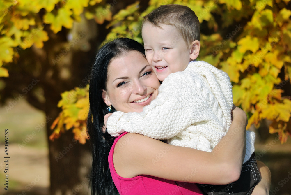 little boy with his mother in autumn park little boy with his mother in autumn park