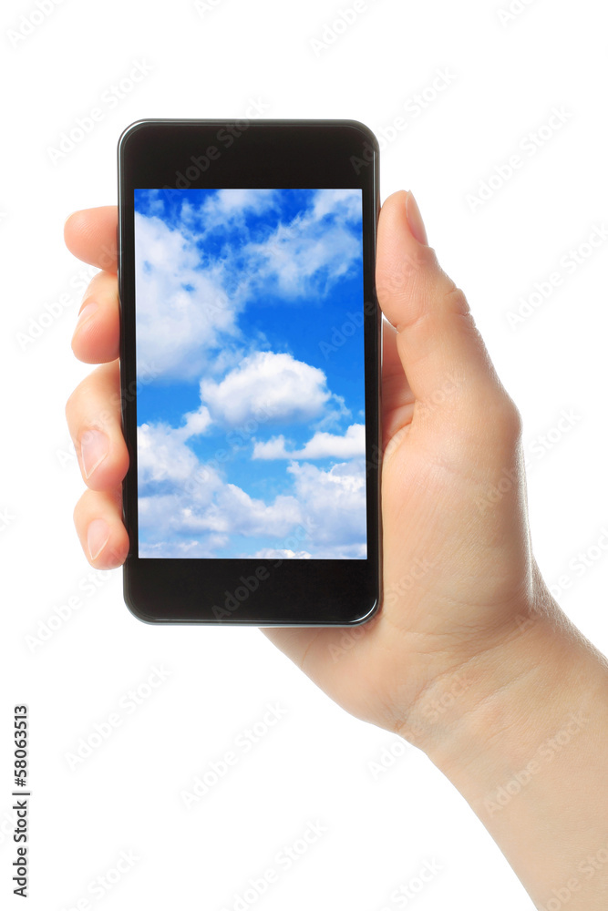 Woman hand holds smart phone with sky 