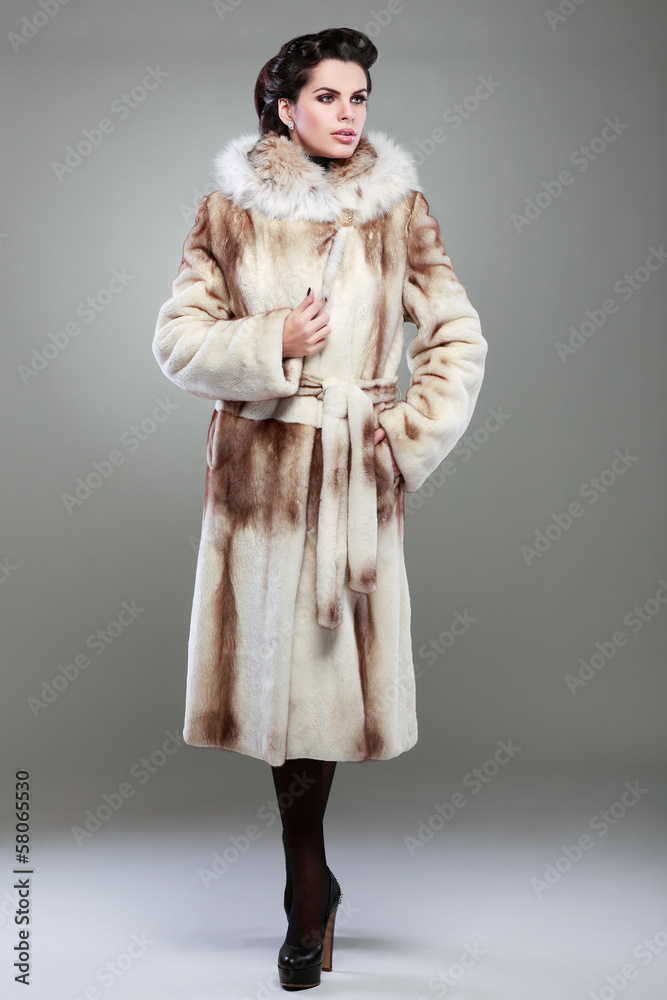 A photo of sexual beautiful girl is in fur clothes A photo of sexual beautiful girl is in fur clothes