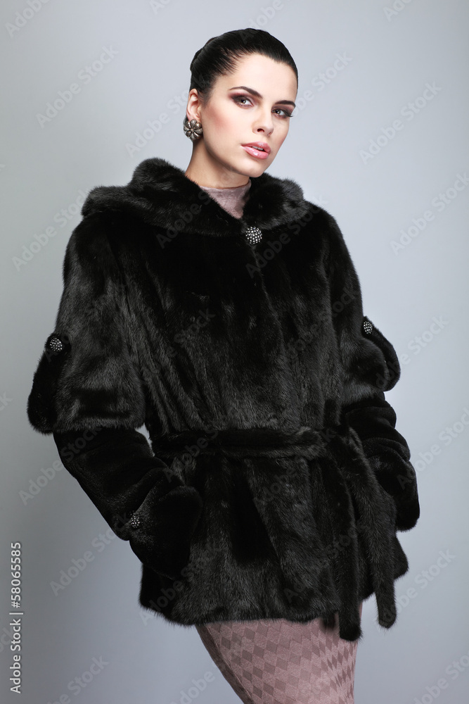 Naklejka premium A photo of sexual beautiful girl is in fur clothes
