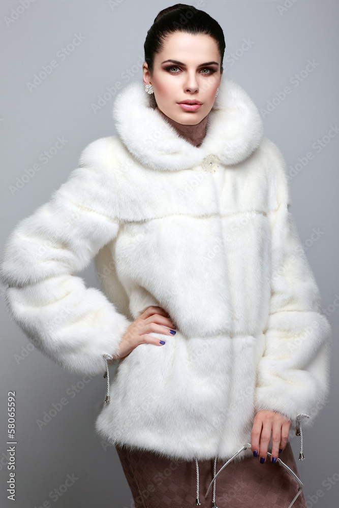 A photo of sexual beautiful girl is in fur clothes A photo of sexual beautiful girl is in fur clothes