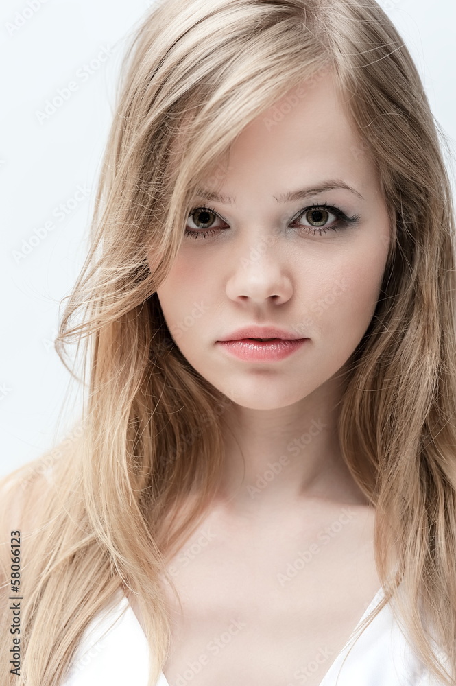 Portrait of a beautiful young girl on a white background Portrait of a beautiful young girl on a white background