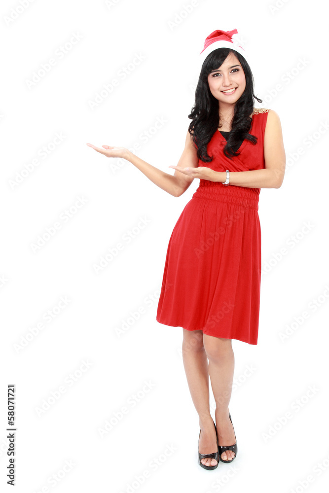 Full length of beautiful woman in christmas santa hat showing co Full length of beautiful woman in christmas santa hat showing co