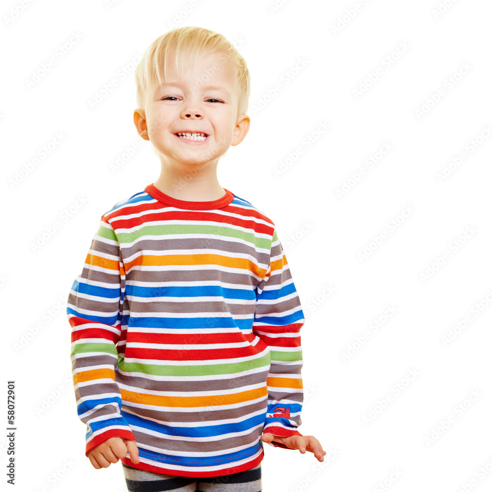Lachendes Kind grinst in die Kamera Lachendes Kind grinst in die Kamera