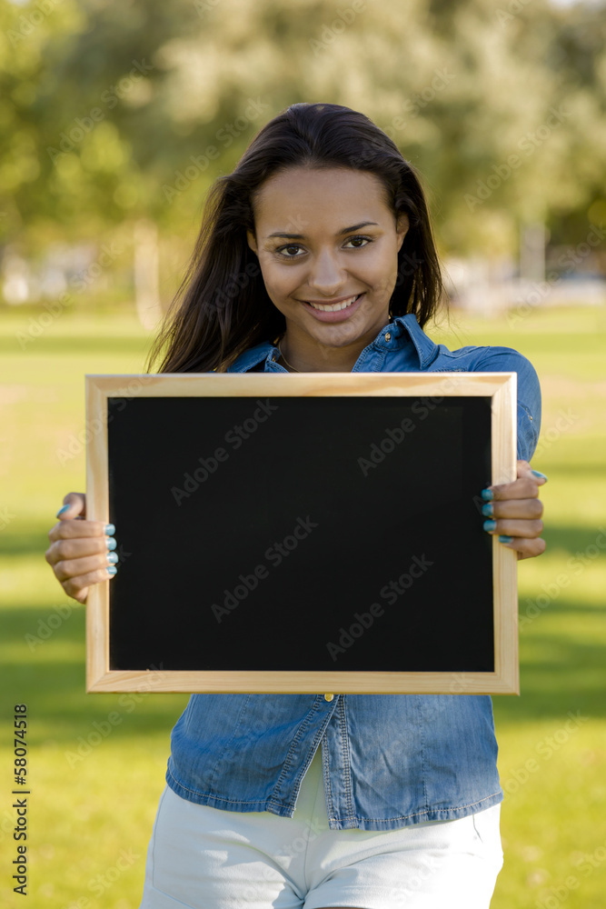 Beautiful woman holding a shalkboard Beautiful woman holding a shalkboard
