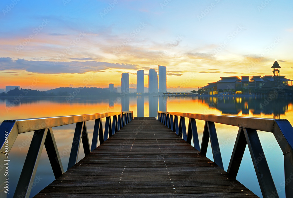 Landscape of wooden bridge at sunrise by the lakeside