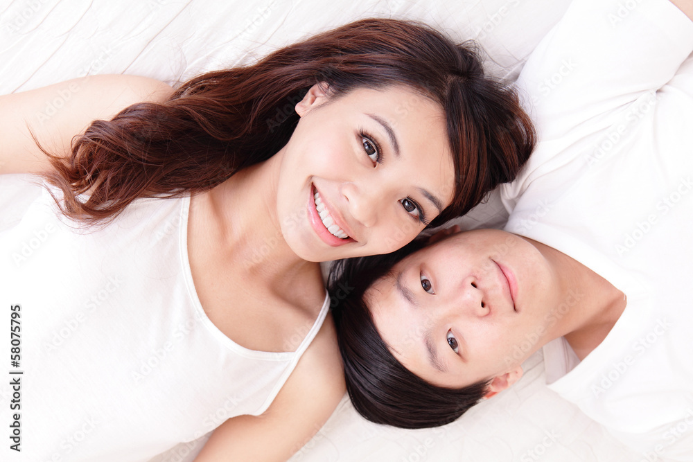 couple happy smile looking to each other in bed