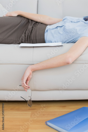 Mid section of slender classy businesswoman lying on couch sleep