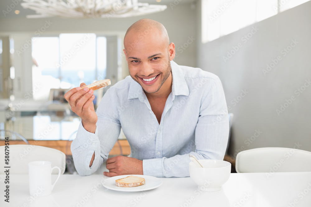 Young man having breakfast at home Young man having breakfast at home