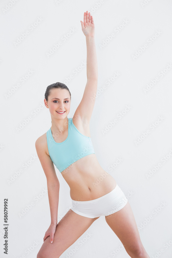 Sporty woman stretching hand in fitness studio Sporty woman stretching hand in fitness studio