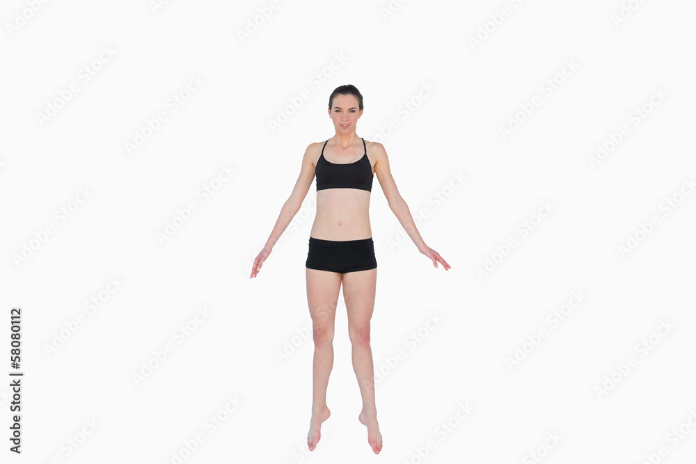 Full length of a sporty young woman standing Full length of a sporty young woman standing