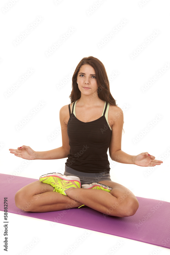 Woman sit yoga hands out serious Woman sit yoga hands out serious