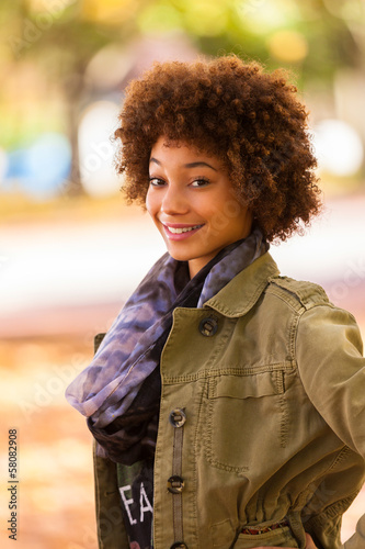 Autumn outdoor portrait of beautiful African American young woma