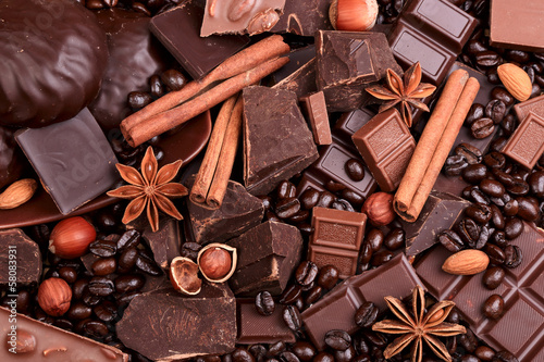 Background from slices of chocolate, coffee, nuts and spices #58083931