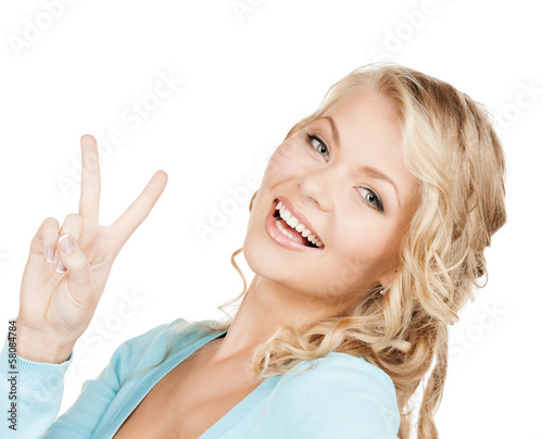 young woman showing victory or peace sign