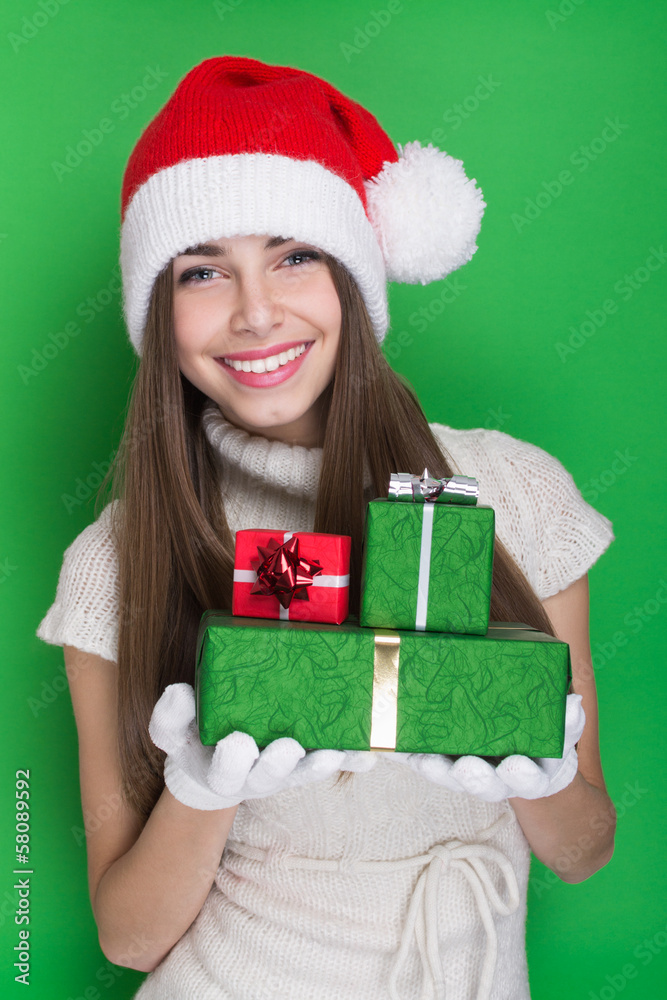 Excited teenage girl holding Christmas presents Excited teenage girl holding Christmas presents