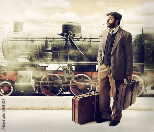 Emigrant to the train station with cardboard suitcases