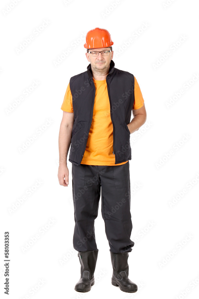 Worker in vest with hard hat and glasses. Worker in vest with hard hat and glasses.