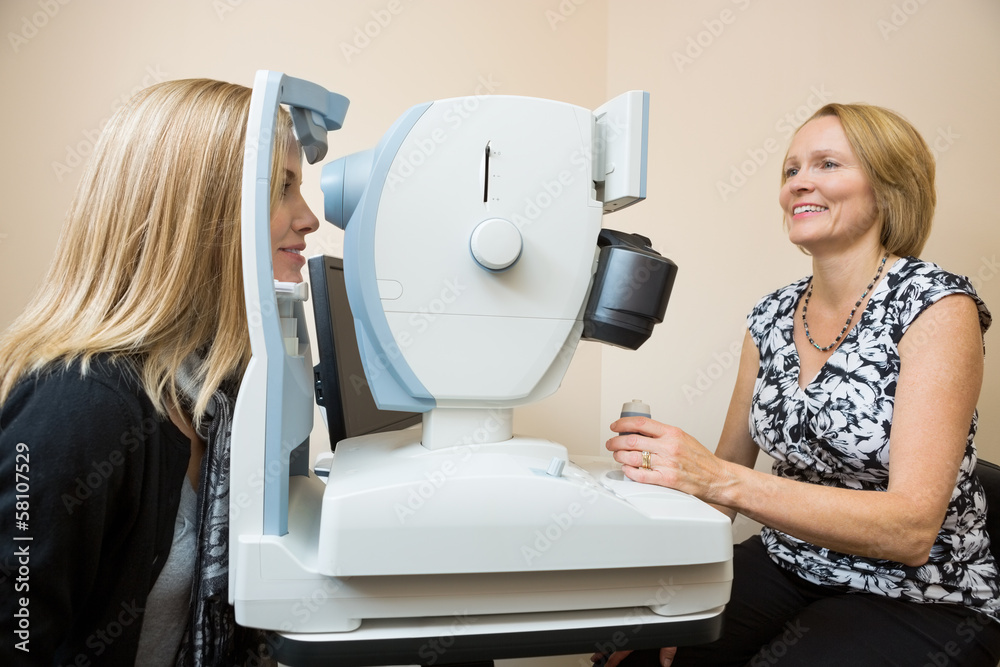Optician Examining Patient's Eye With Retina Camera