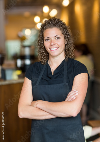 Waitress Standing Arms Crossed In Espresso Bar