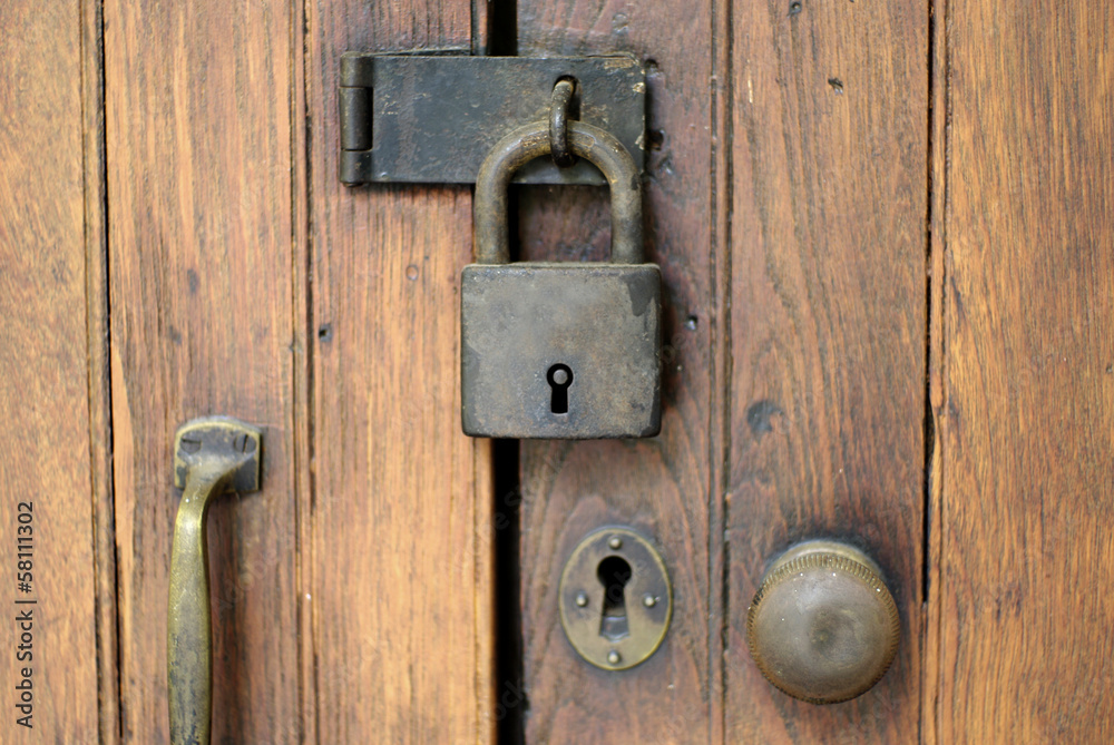 old lock on wood door, security abstract