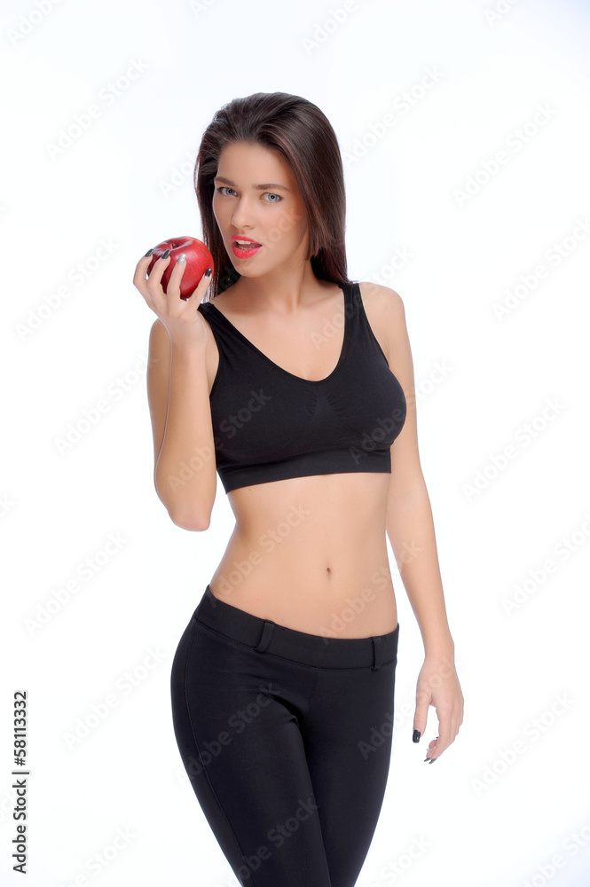 Cute young lady holding red apple while isolated on white.. Cute young lady holding red apple while isolated on white..