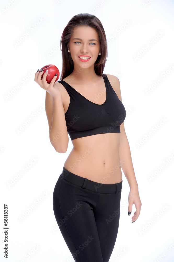 Cute young lady holding red apple while isolated on white.. Cute young lady holding red apple while isolated on white..