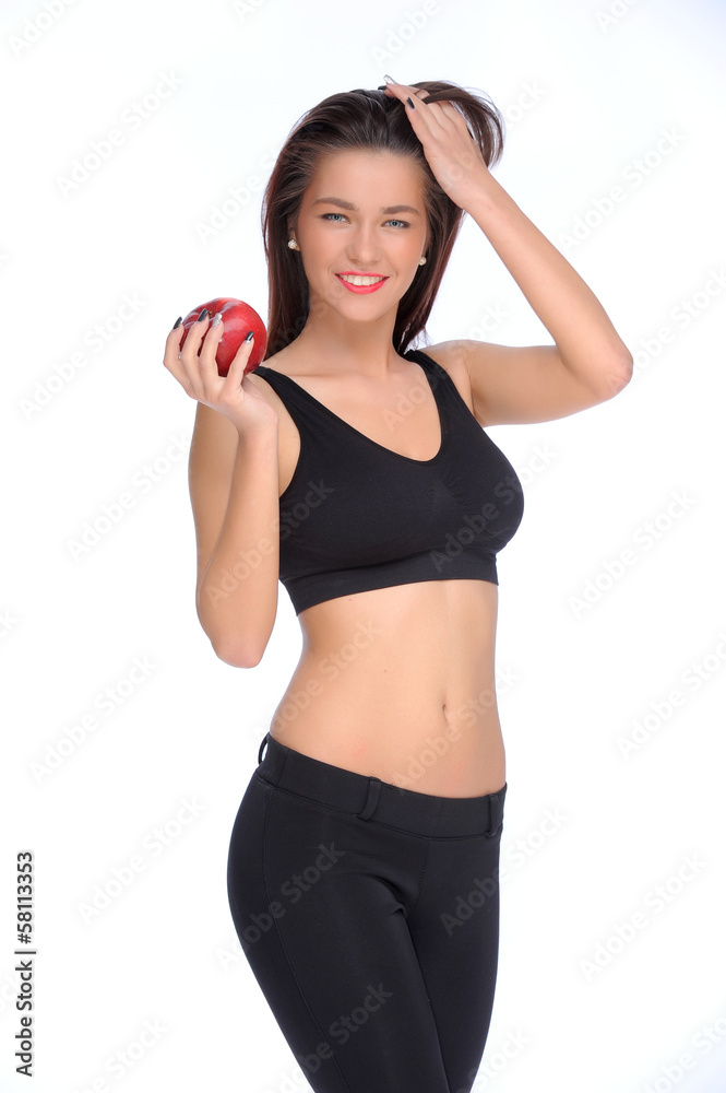 Cute young lady holding red apple while isolated on white.. Cute young lady holding red apple while isolated on white..
